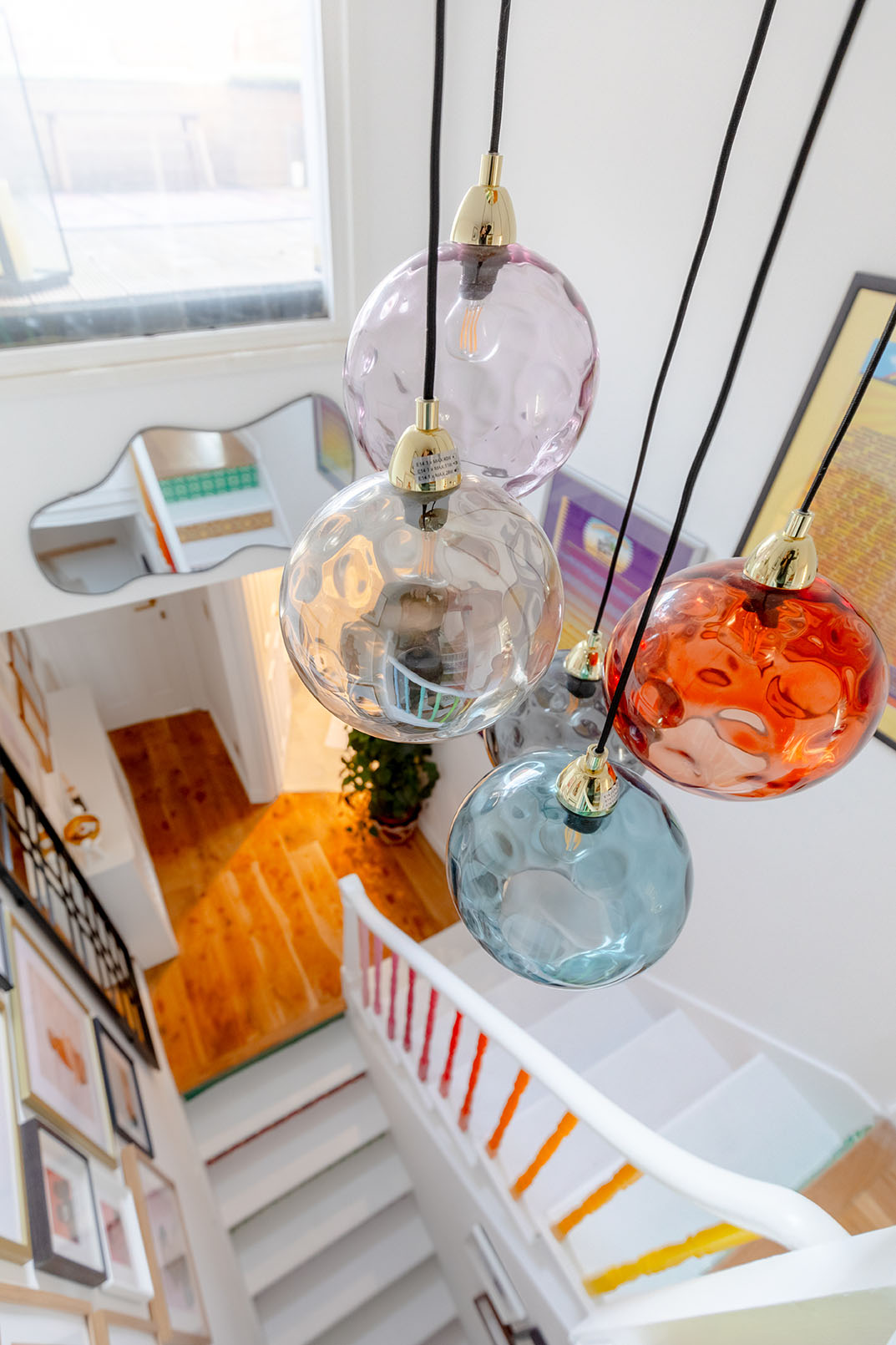 Coloured glass lights hanging from the ceiling, photo taken for Airbnb home listing