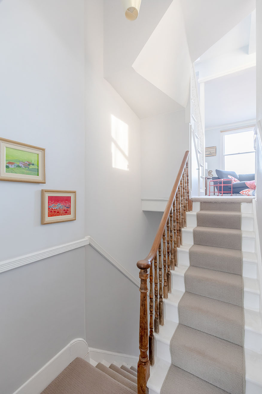 Staircase in a house captured for property photography to show the connection between the levels.