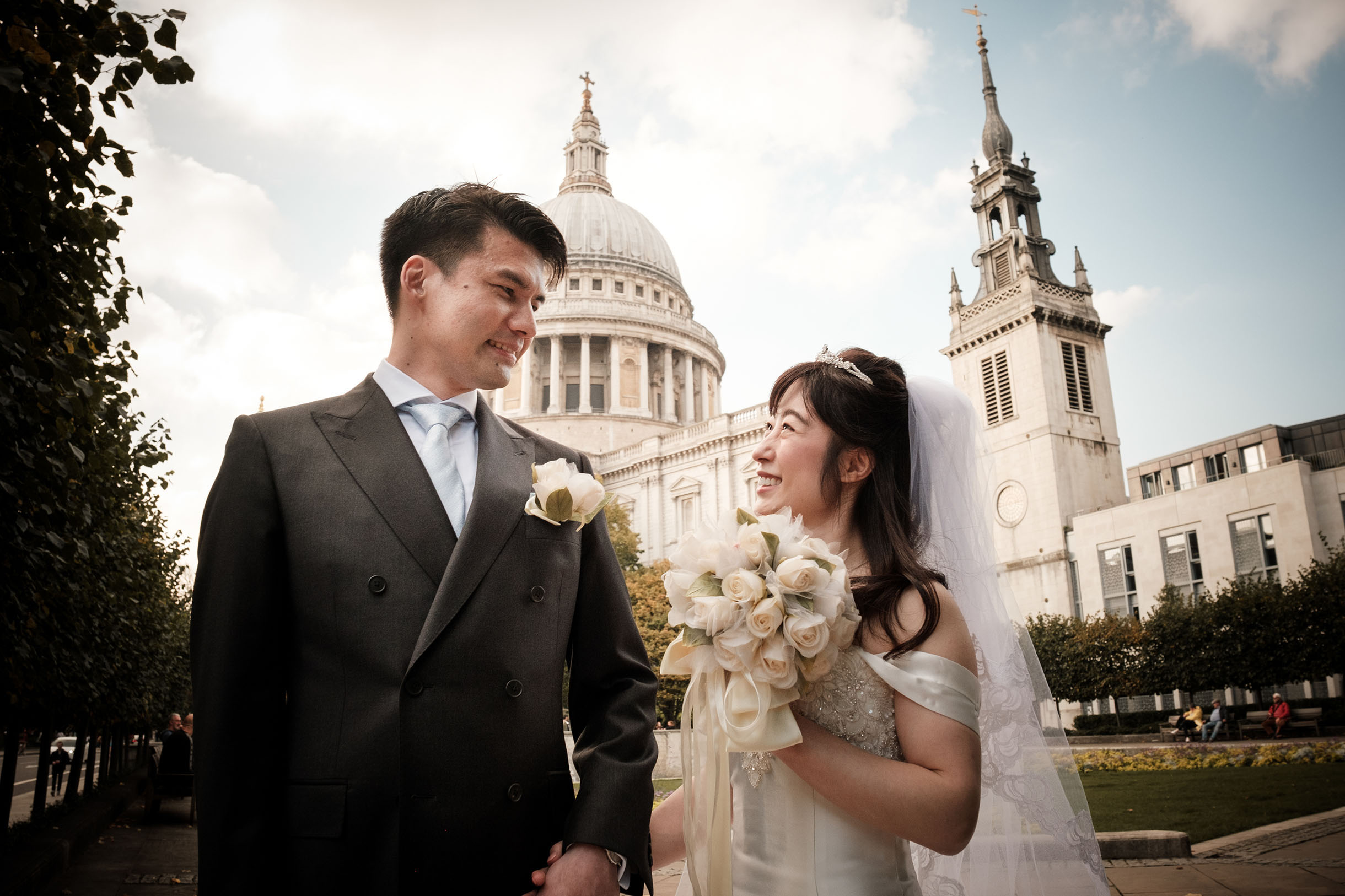 Wedding photography of a couple, looking at each other, London outdoors around St Paul's cathedral.